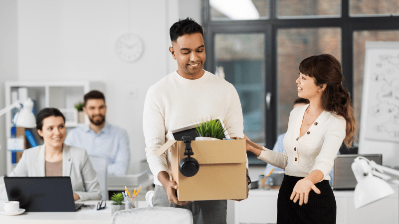 Staff welcoming a new successful hire into the office